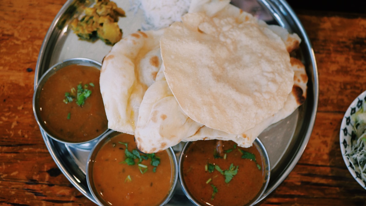 Flames leaping from the tandoor